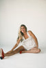 a white tank with a babydoll style silhouette + eyelet details. pair it with the matching white shorts to create the perfect two piece set for brunch dates, vacations, + everyday wear. 