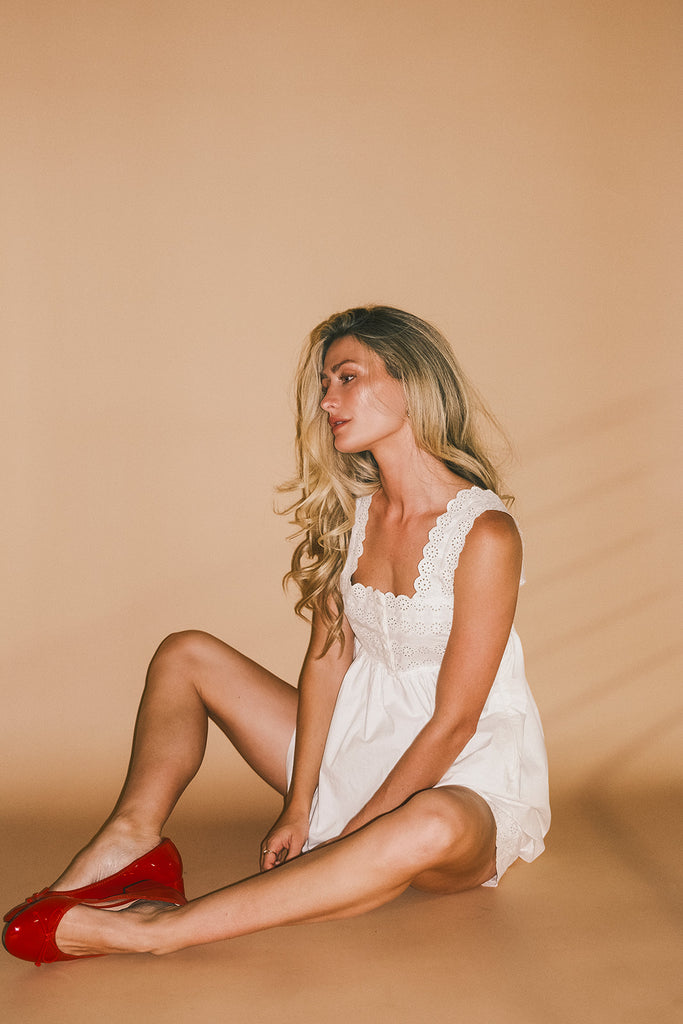 white cotton shorts with eyelet details. pair them with the matching white tank top to create the perfect two piece set for brunch dates, vacations, + everyday wear. 