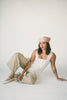 a white tank with a babydoll style silhouette + eyelet details. pair it with the matching white shorts to create the perfect two piece set for brunch dates, vacations, + everyday wear. 