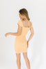 orange mini dress with a sweetheart neckline, ribbed texture, bodycon fit