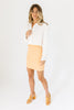orange mini dress with a sweetheart neckline, ribbed texture, bodycon fit