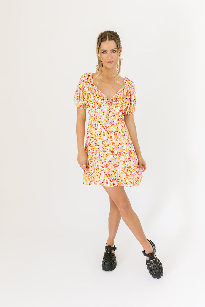 multicolor floral mini dress with a sweetheart neckline, working front tie, back zipper, balloon sleeves, and fully lined