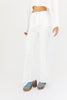 white denim with embroidered daisies, slight flare, one button zipper fly, pockets, and belt loops.